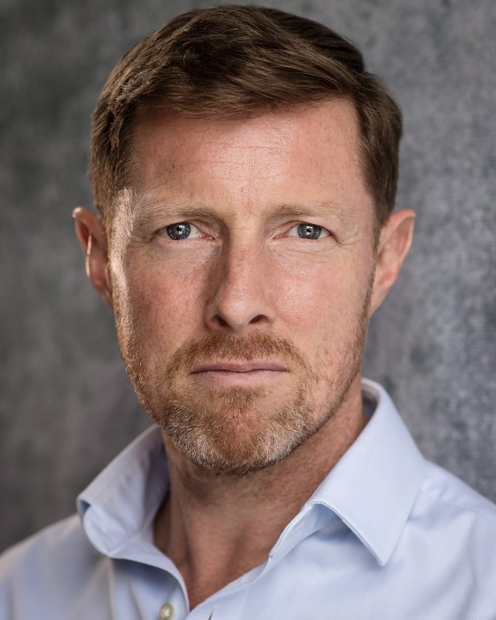 A headshot of Christopher