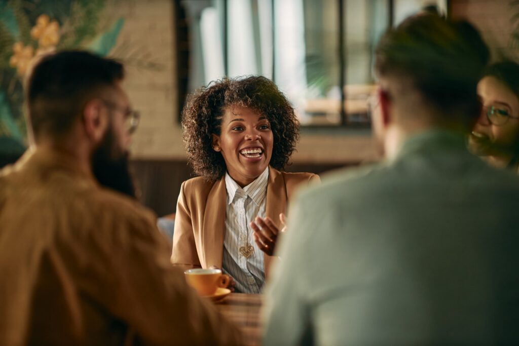 Image of people having a meeting at a cafe